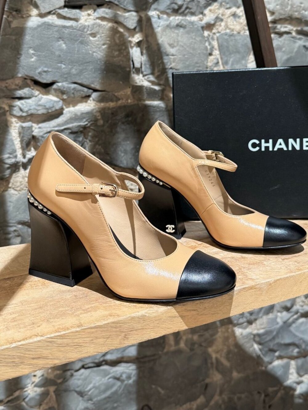 Chanel 2022 Beige Black Pearl CC Accent Heeled Mary Jane Pumps.